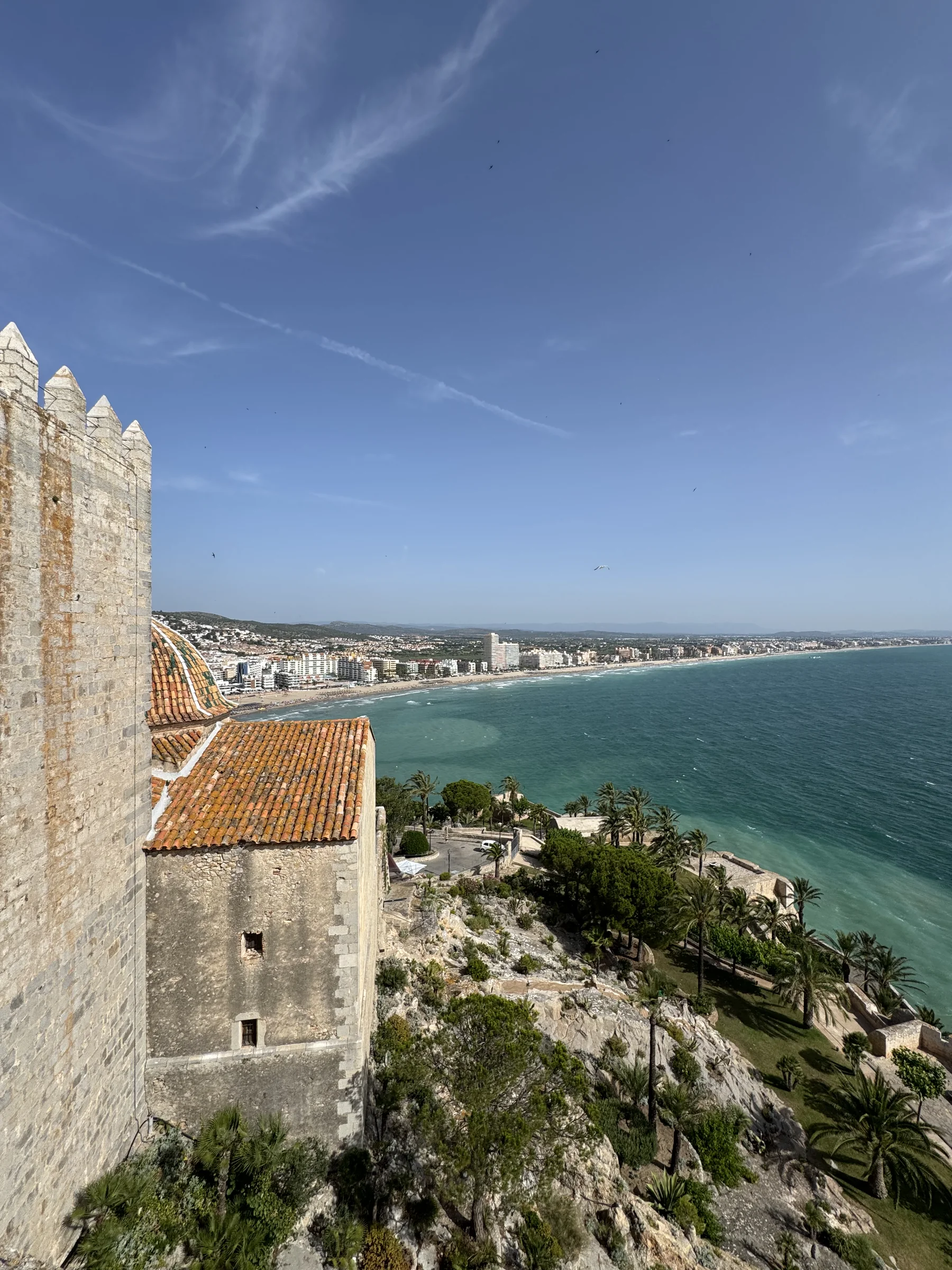 A wide panorama of the Costa Azahar coastline meeting the Mediterranean sea.